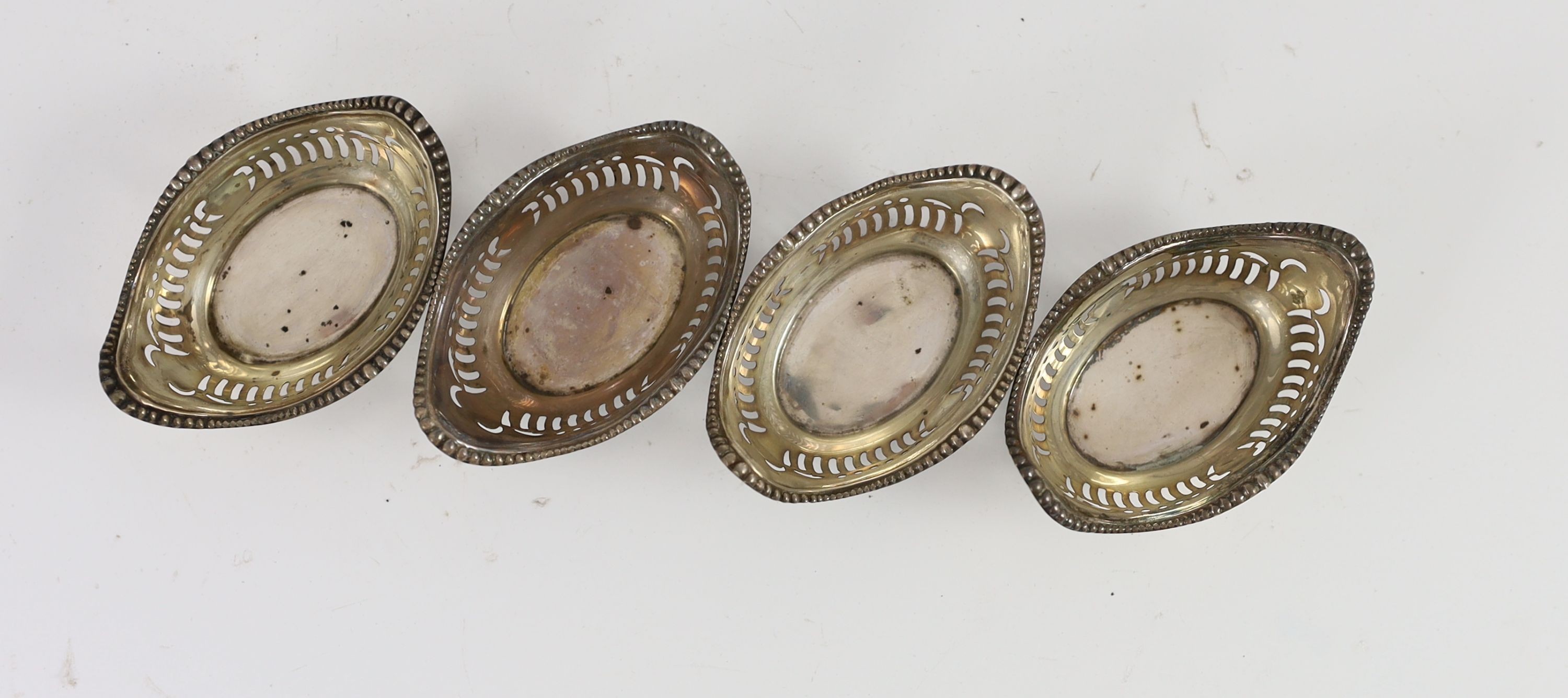 A set of four Edward VII silver pierced oval bon-bon dishes, 8cm wide 1.96oz.